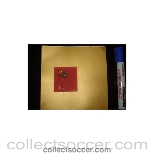 A greetings card with a tiny taxi car football souvenir